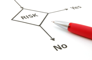 A picture of a risk assessment flow chart and red pen